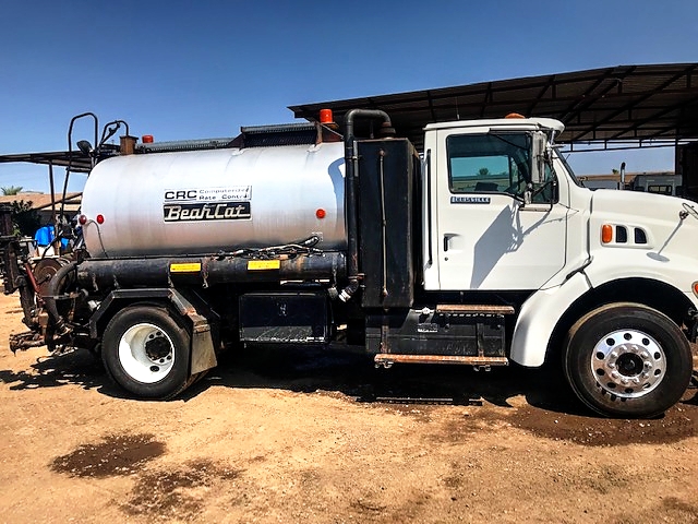 1998 Ford Louisville with 1,300 Gallon Bearcat CRC Computerized Spreader Unit Asphalt 