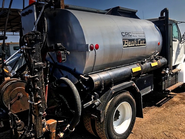 1998 Ford Louisville with 1,300 Gallon Bearcat CRC Computerized Spreader Unit Asphalt 